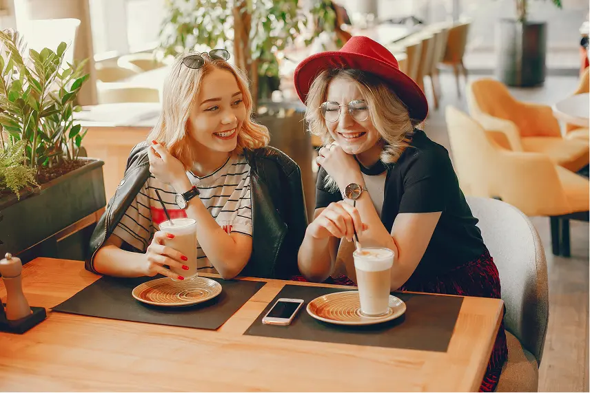 two friends drinking cappuccino.webp